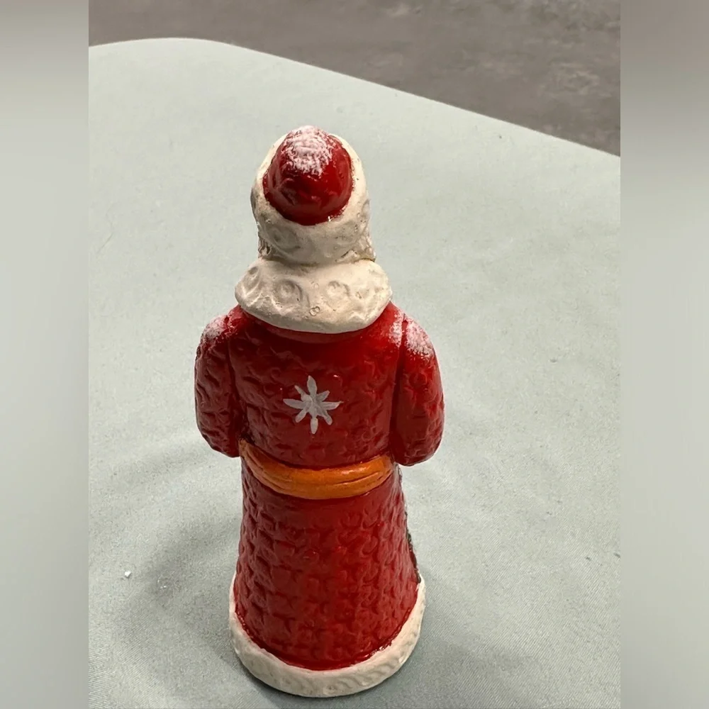 Resin Santa figure carries a special greeting